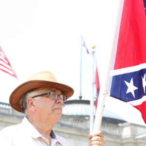 Thom Robb, the national director of the Knights Party of the Ku Klux Klan, stood between The Satanic Temple rally and the doors of the Capitol. “Well, we came here because of the Satanists having their demonstration. So we came out here, not as a protest, but just as a witness. Stand as a silent witness for our Christian faith and Christian nation.” Credit Bobby Ampezzan