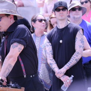 AMPEZZAN/Arkansas Public Media - Johnny Depp (speaking) and Damien Echols (center) at the Arkansas Coalition to Abolish the Death Penalty rally on the Capitol steps 14 April 2017. Credit Bobby Ampezzan
