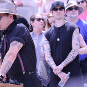 AMPEZZAN/Arkansas Public Media - Johnny Depp (speaking) and Damien Echols (center) at the Arkansas Coalition to Abolish the Death Penalty rally on the Capitol steps 14 April 2017. Credit Bobby Ampezzan