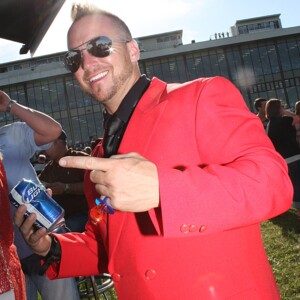 Arkansas Democrat-Gazette/BOBBY AMPEZZAN - 4/13/13 - Shawn Boutwell of Little Rock in the Oaklawn infield for the Arkansas Derby. Suit from Fauzio's. Ring Pop by Topps.