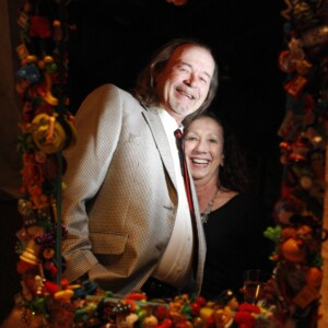 Arkansas Democrat-Gazette/BOBBY AMPEZZAN — 4/5/13 — Mark Holder and Kathleen Kennally are reflected in Kennally's contribution to the 22nd Eggshibition to benefit Youth Home, Child's Play mirror, at UALR's Jack Stephens arena.