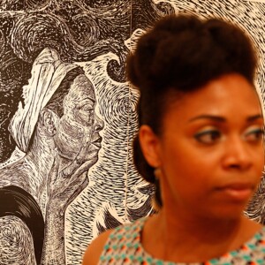 BOBBY AMPEZZAN/Arkansas Democrat-Gazette - LaToya Hobbs stands before her self-portrait inside the Hearne Gallery in Little Rock, June 2013.
