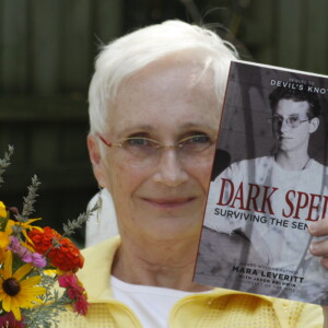 Arkansas Democrat-Gazette/BOBBY AMPEZZAN 7/22/14 Mara Leveritt with her self-published book Dark Spell for 080314 Sunday Style cover story.